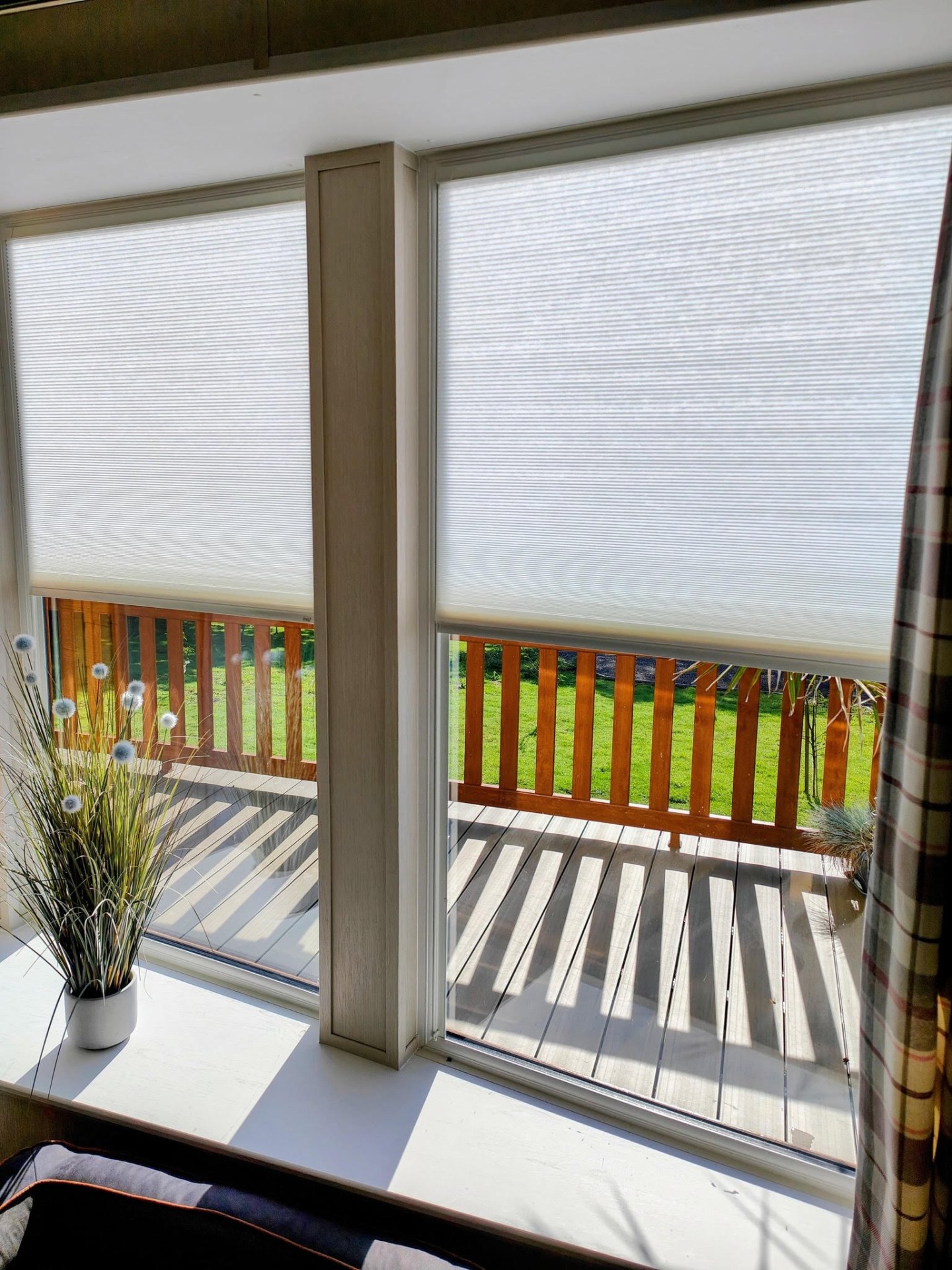 White pleated Perfect Fit blinds fitted neatly into a modern window