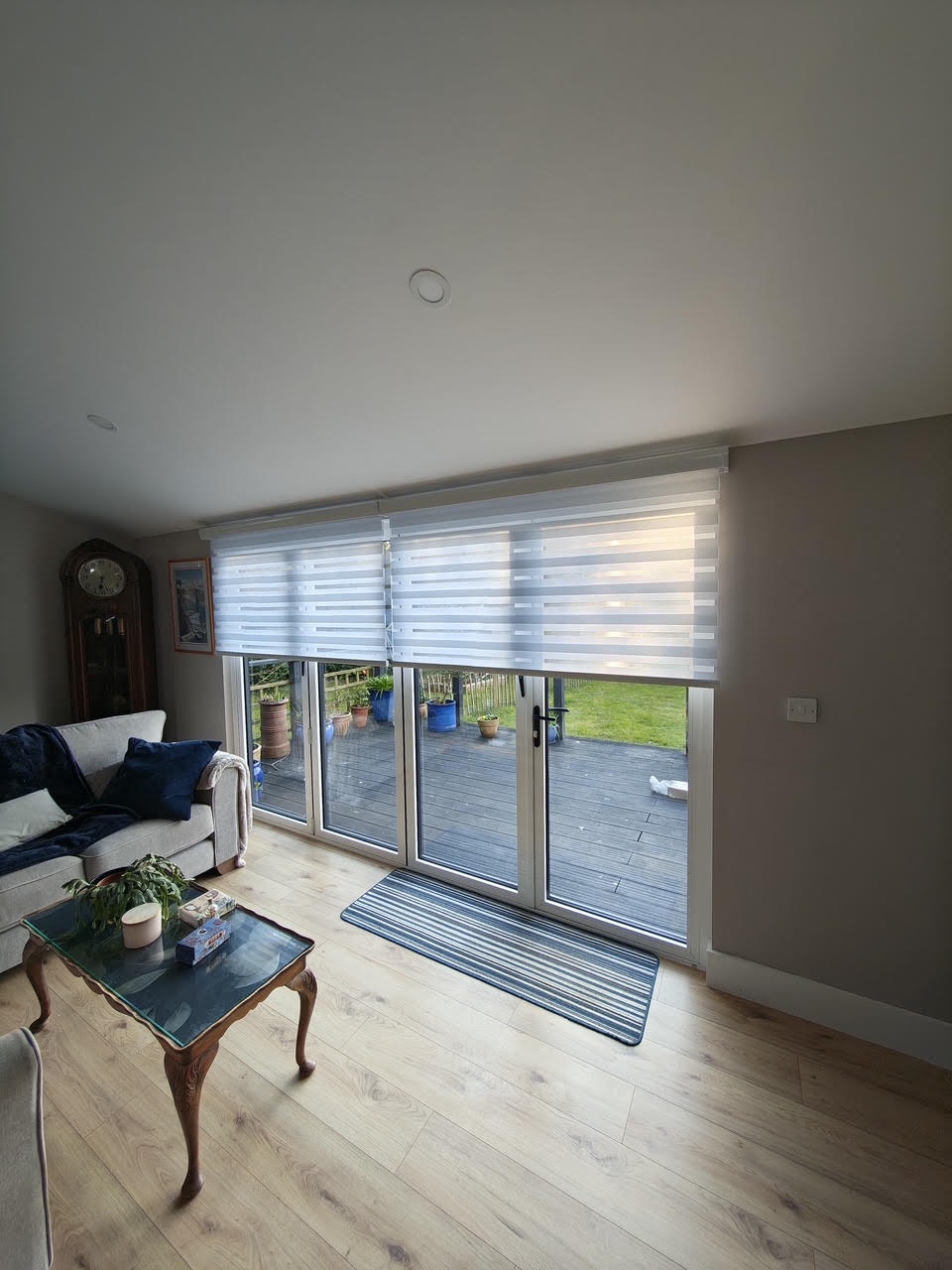 Motorised day and night blinds across large patio doors